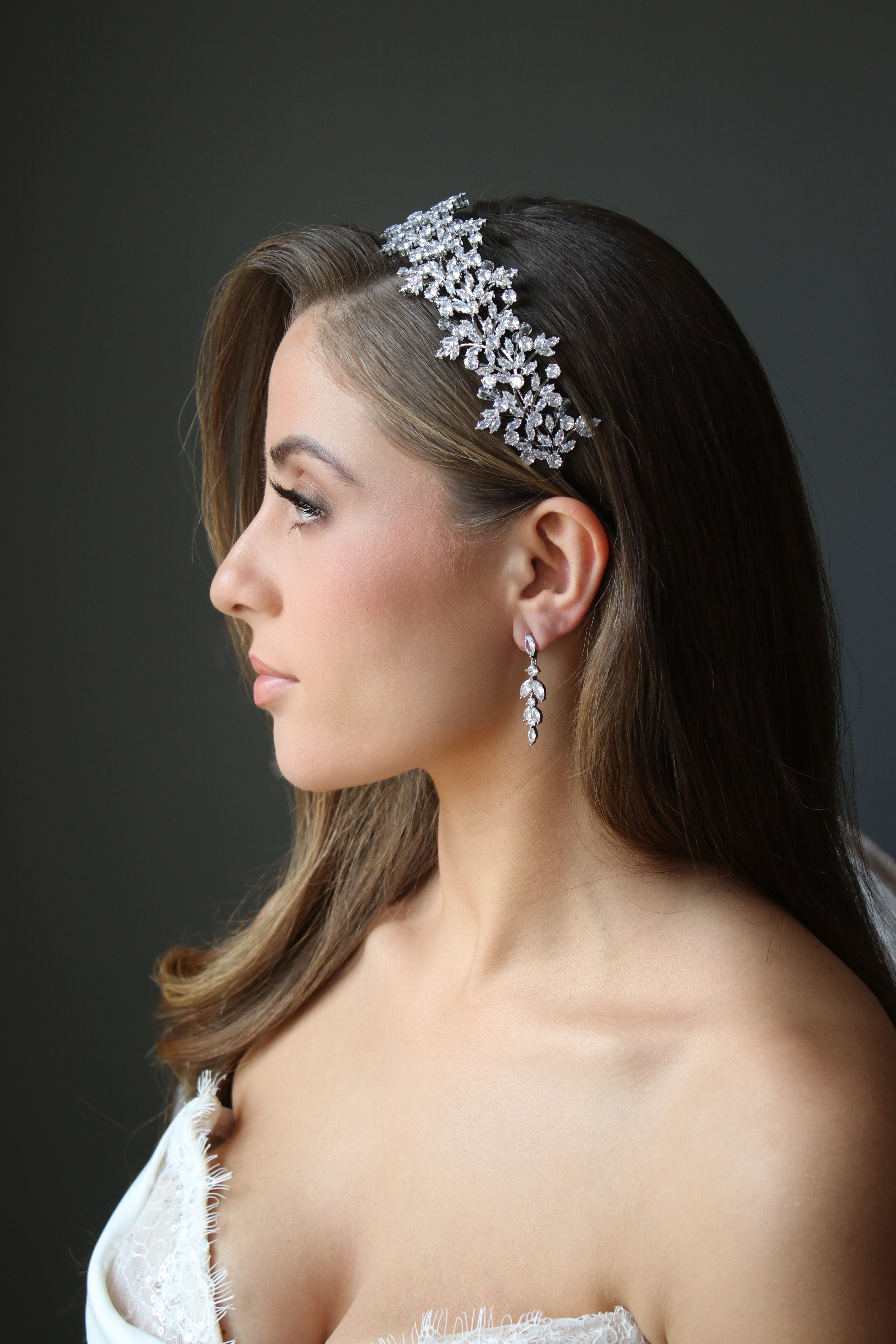 Bride wearing headband and matching earrings | EDEN LUXE Bridal