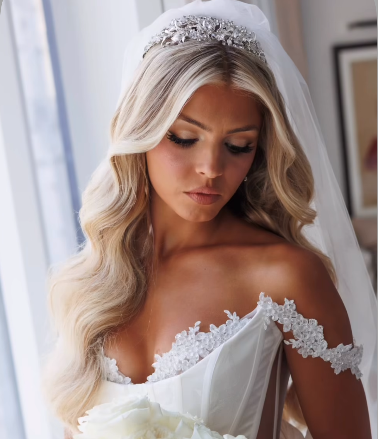 EDEN LUXE Bridal Headband - Woman in a white wedding dress holding a bouquet, with a blurred background