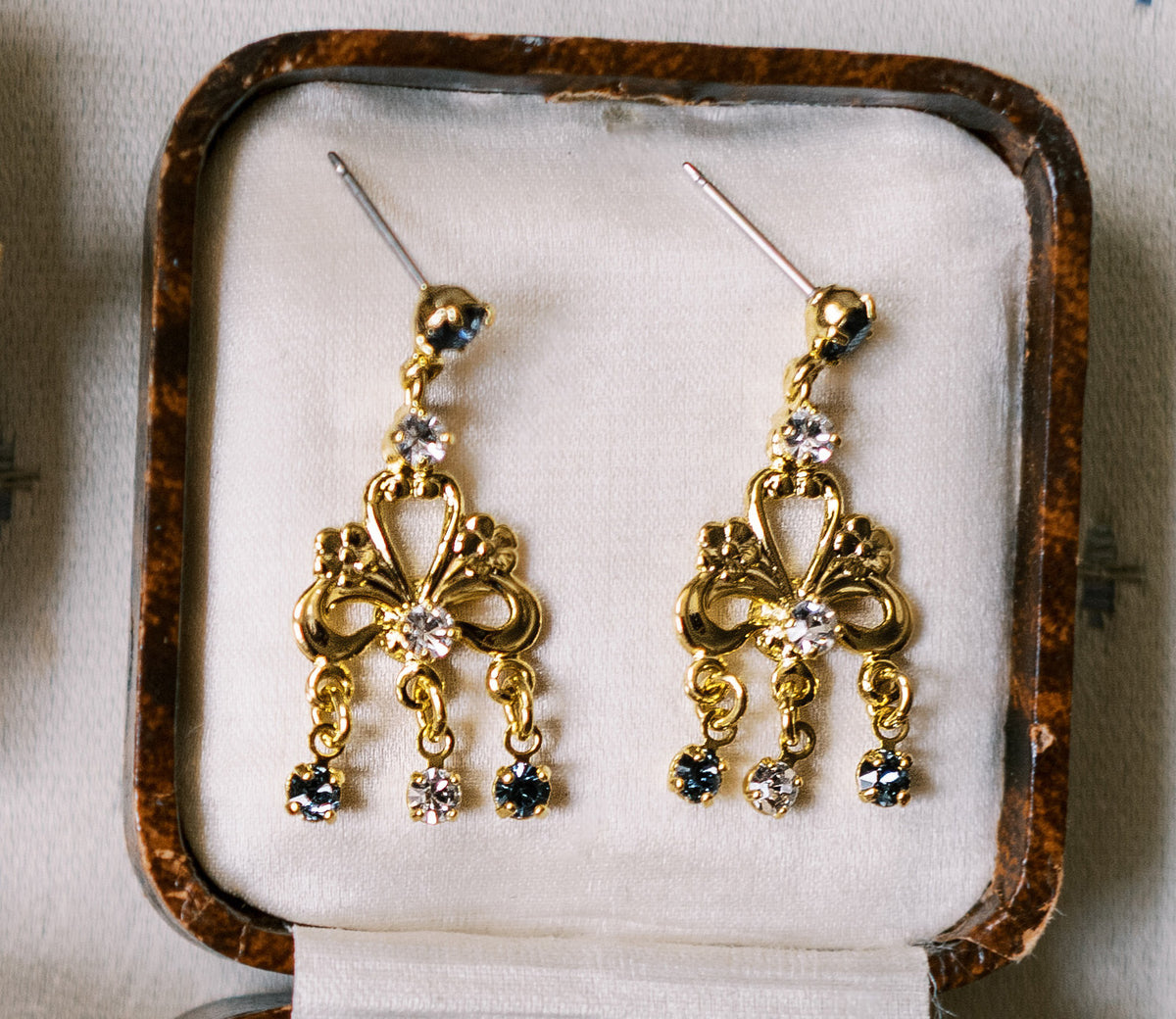 Martha Chandelier Earrings, 14k gold plated clear and French blue Swarovski crystal chandelier earrings, in an antique jewelry box, Sophie Kaye x EDEN LUXE Revolution Collection | EDEN LUXE Bridal