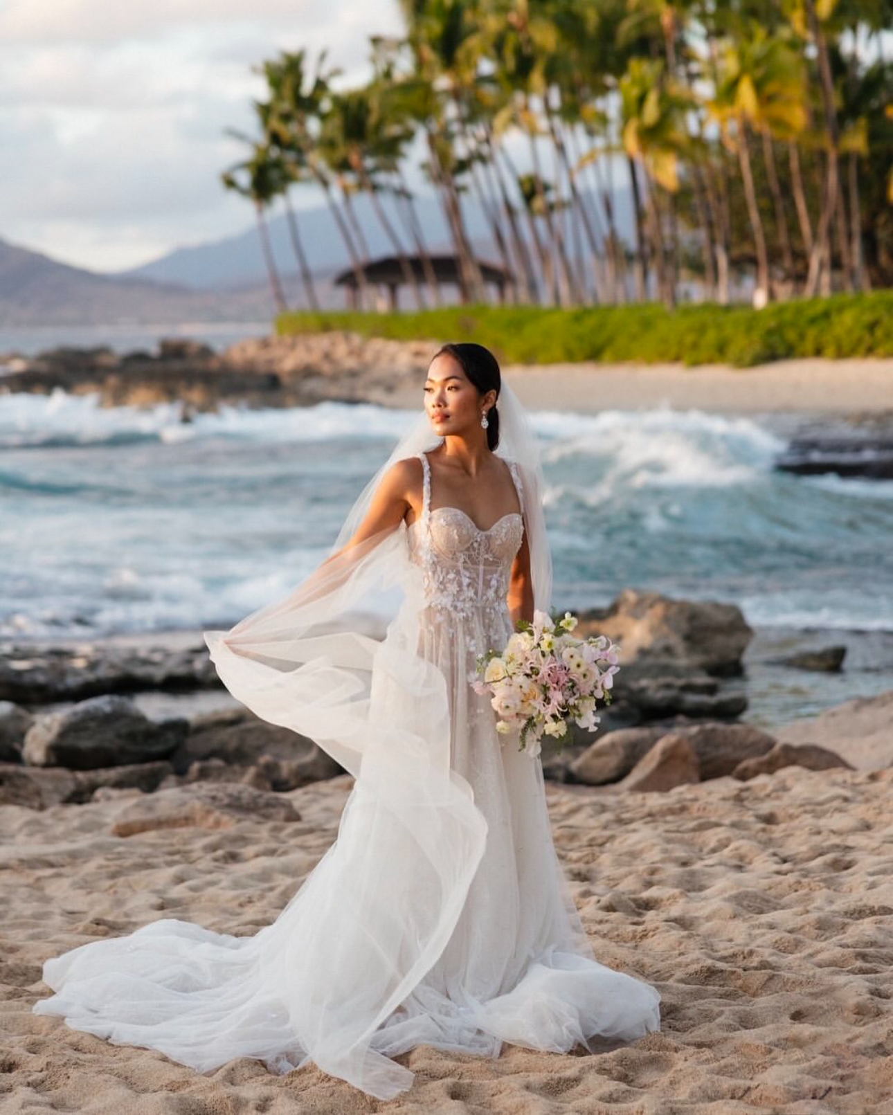Bride Wearing Statement Wedding Earrings on the beach | EDEN LUXE Bridal 