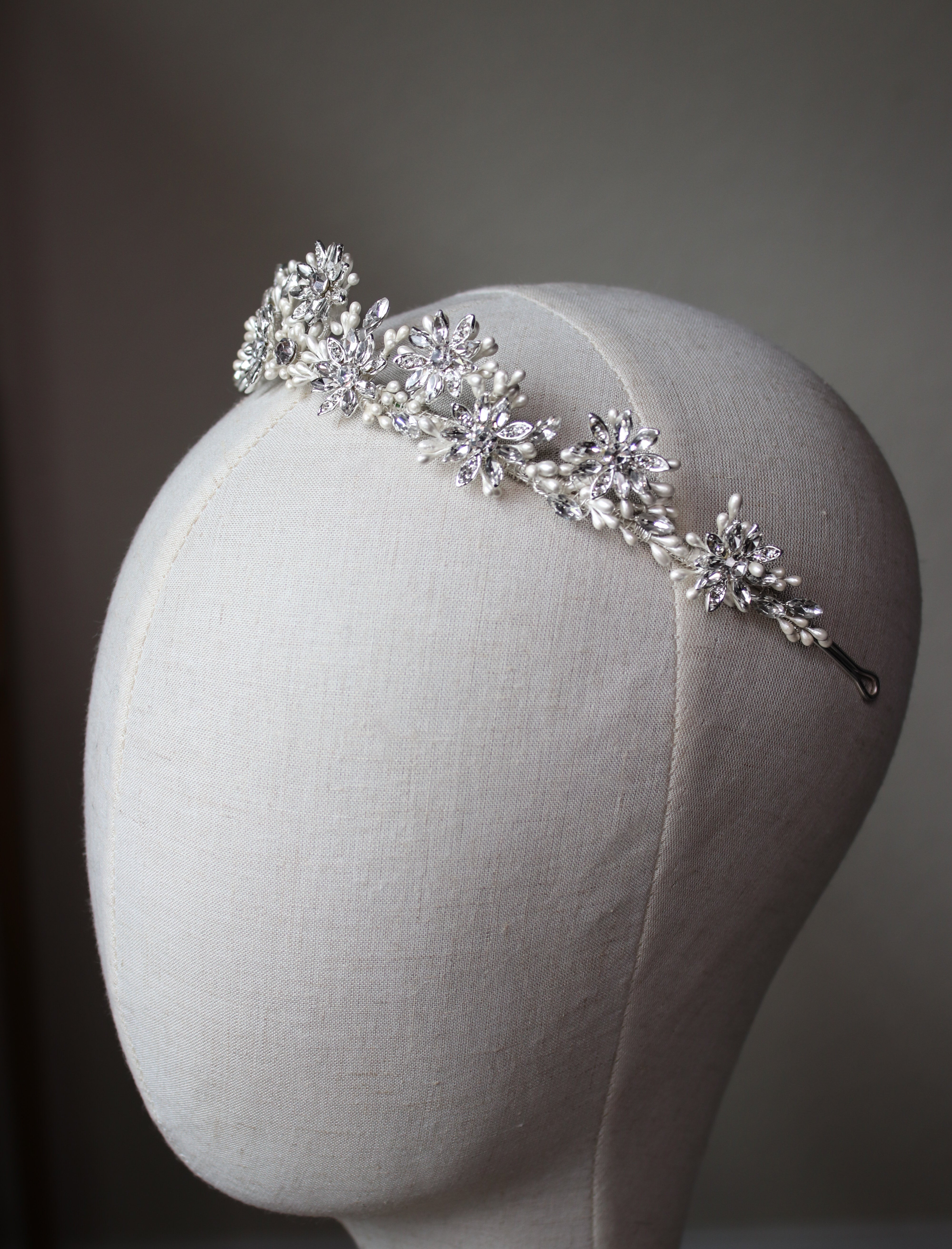 Close-up of Etoiles en Chantilly Crown’s lace-like filigree and shimmering crystals in silver-tone finish | EDEN LUXE Bridal 
