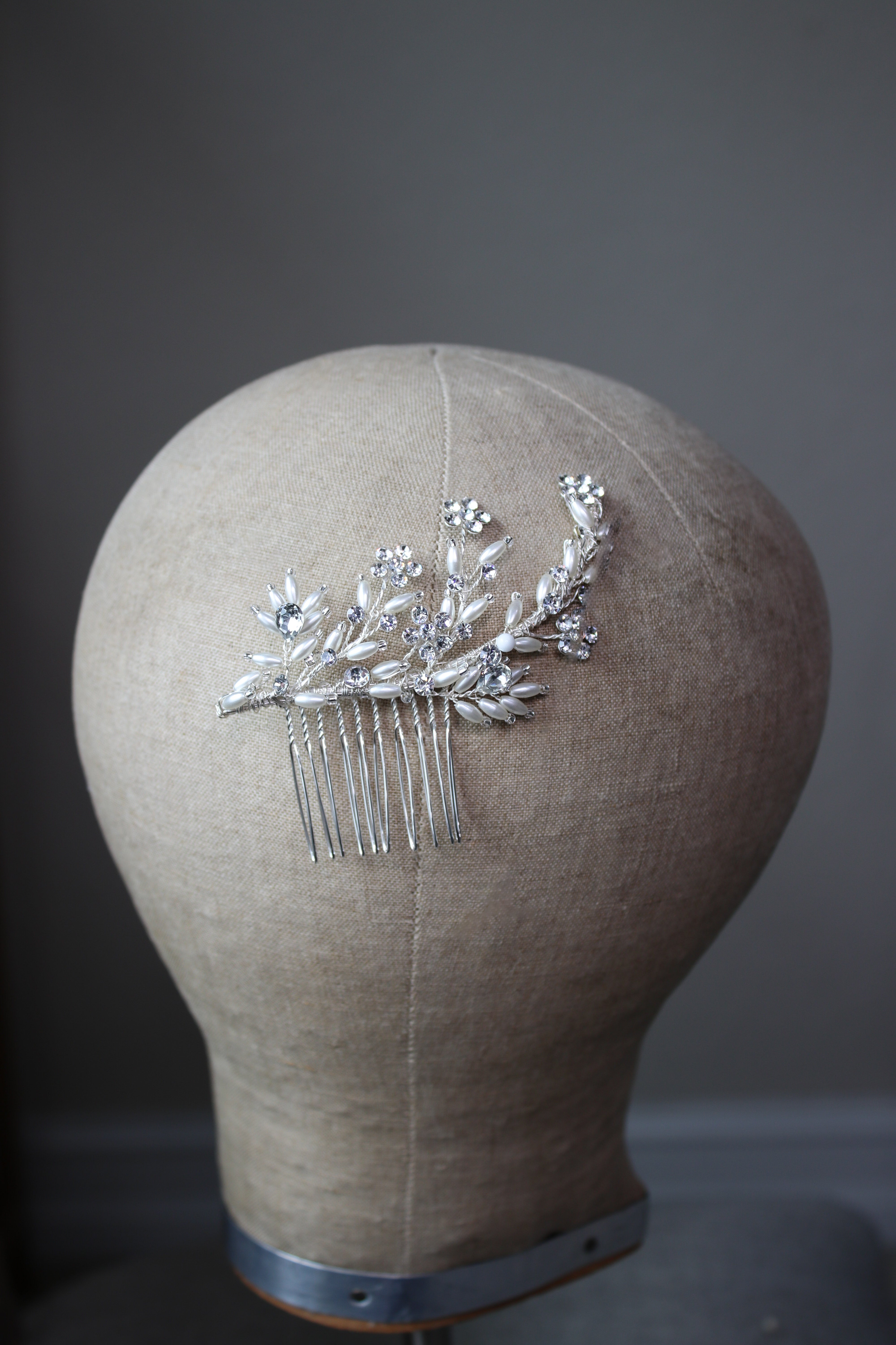 Petite Arden Comb—elongated creamy faux pearl and crystal bridal hair comb adding refined, minimalist sparkle to a low chignon | EDEN LUXE Bridal 