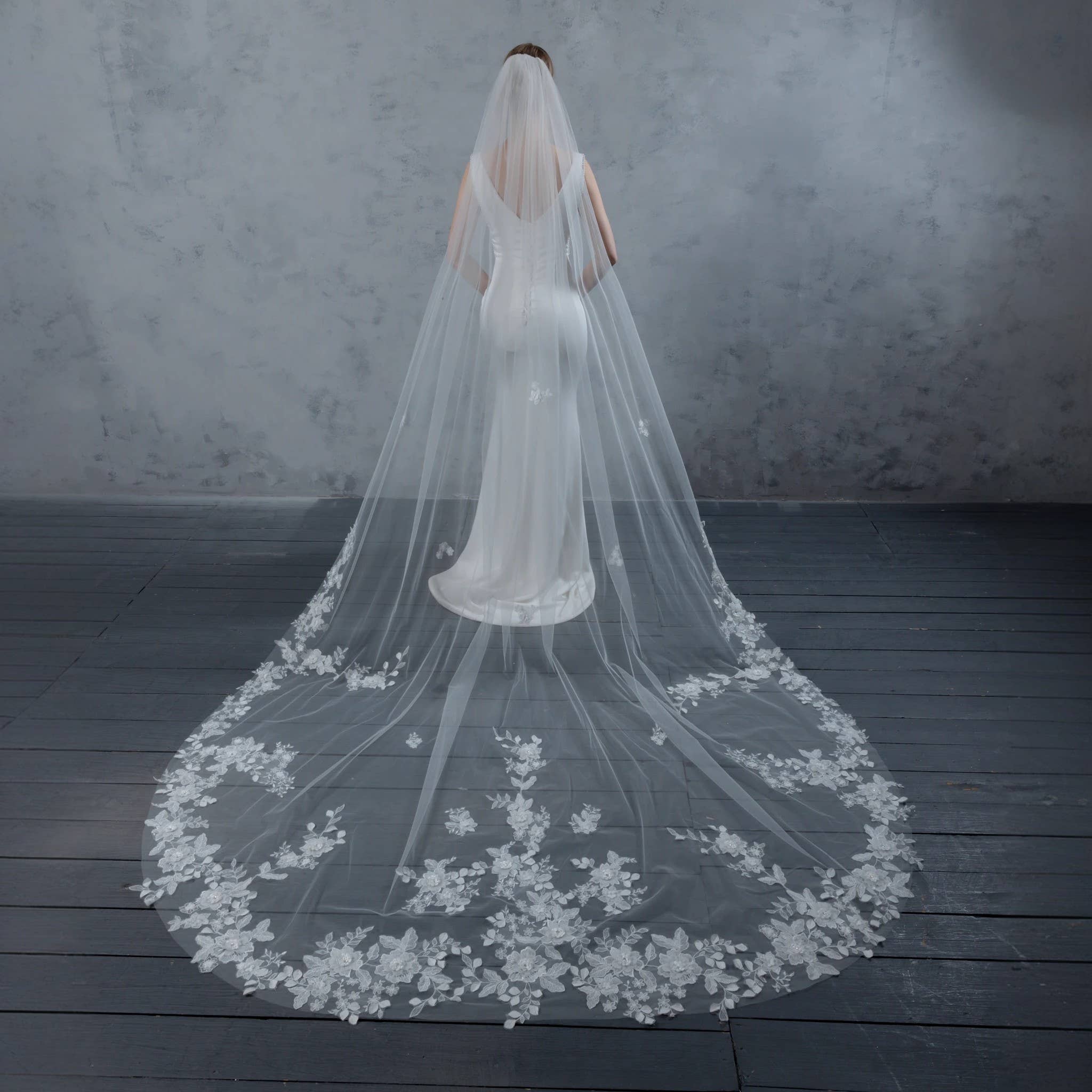 Wide cathedral veil in pale ivory bridal illusion tulle, 120 inches by 90 inches, trailing dramatically behind bride | EDEN LUXE Bridal