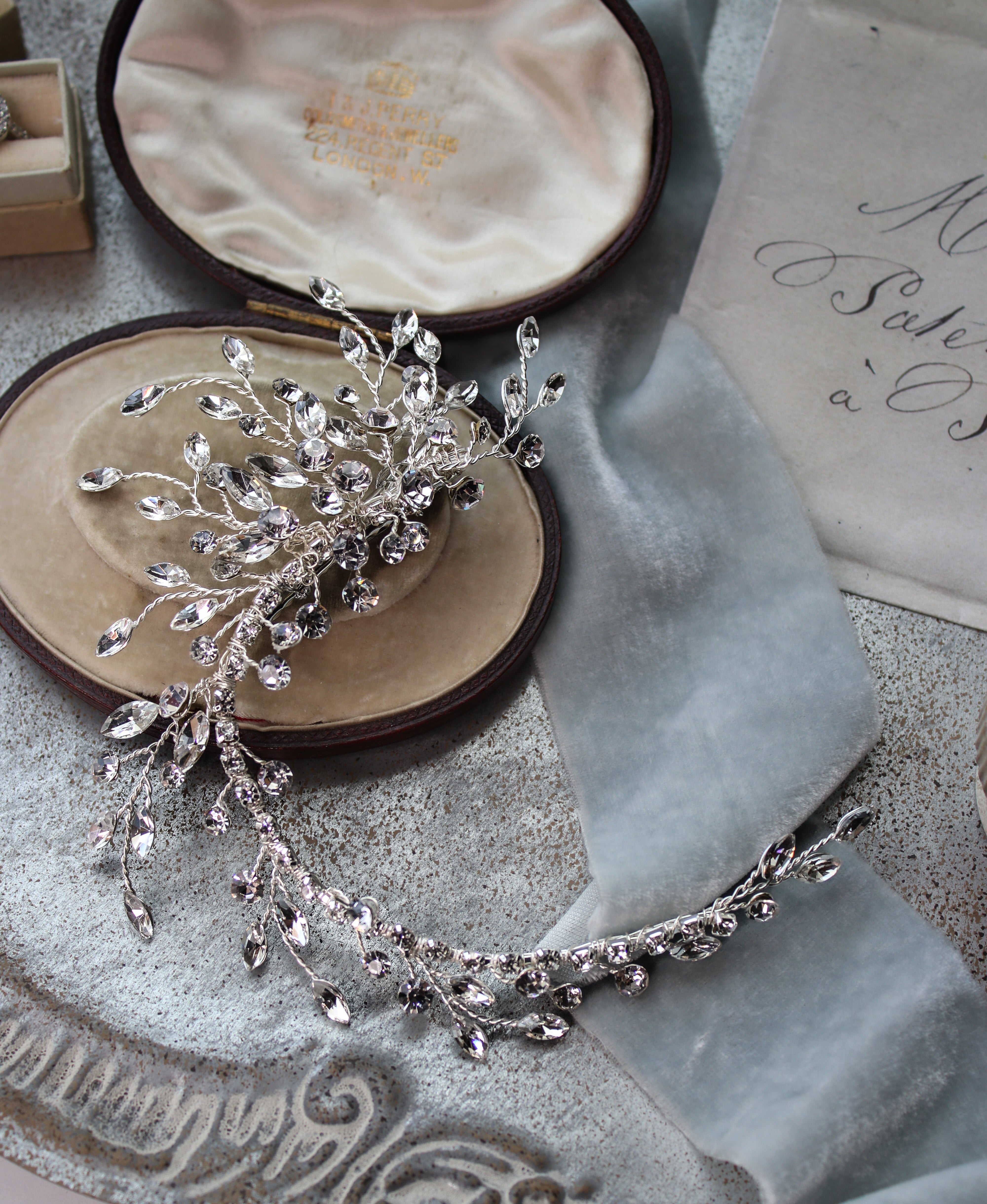 Daniela Spray ultra-light handset crystal bridal hair clip on a low chignon with alligator clip attachment | EDEN LUXE Bridal