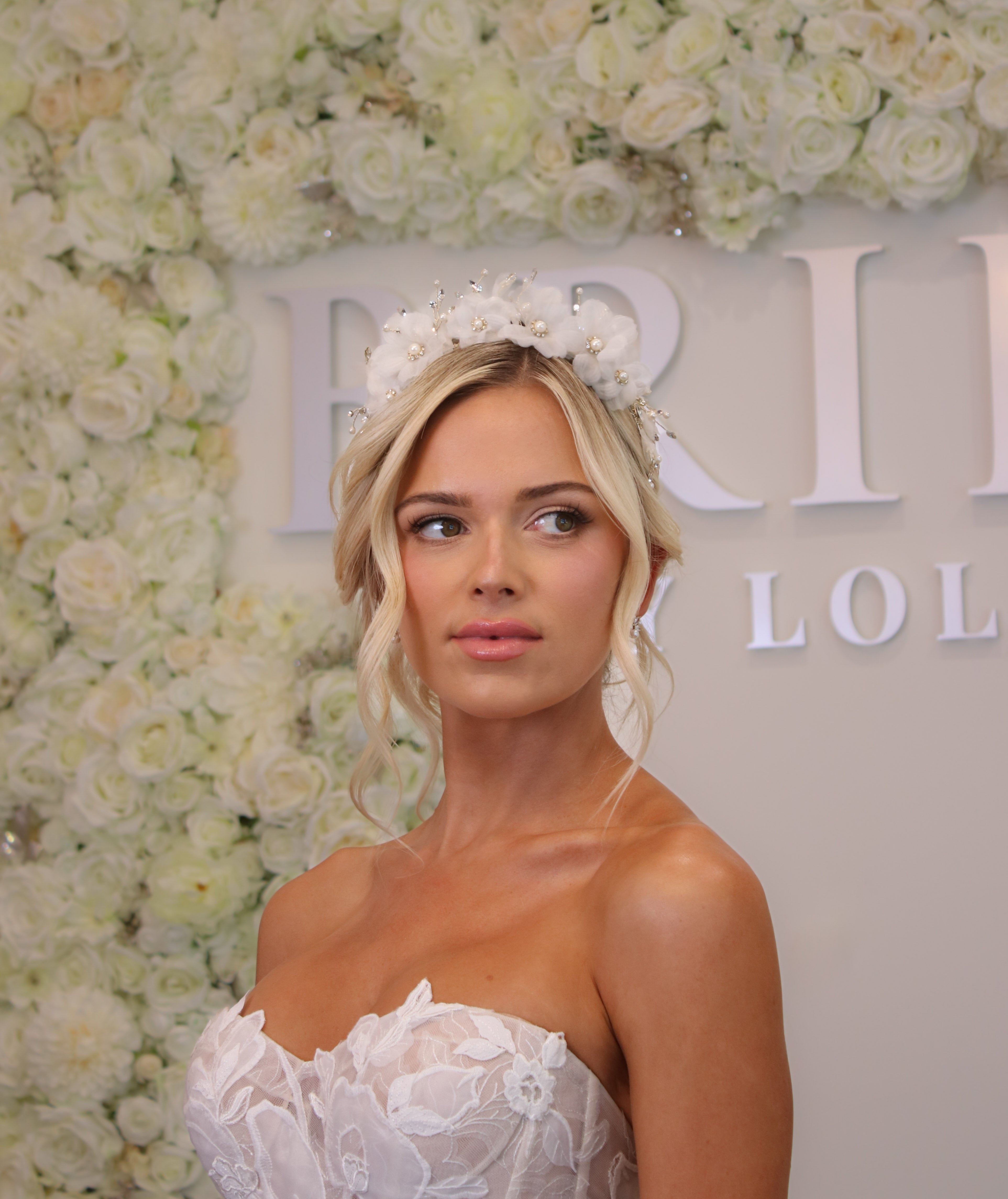 Romantic floral hair accessory styled with a low bridal bun | EDEN LUXE Bridal