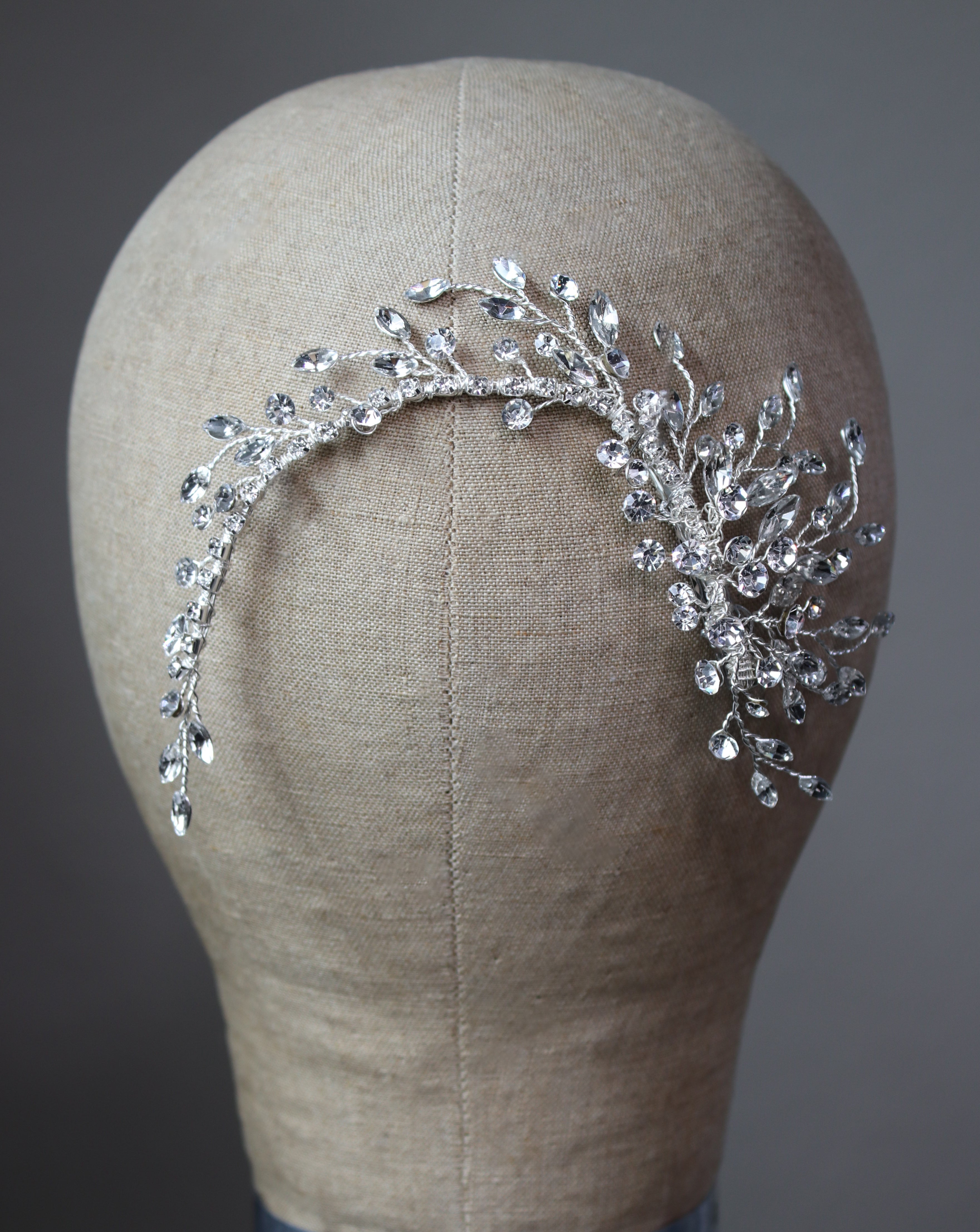 Veil-friendly, lightweight crystal spray clip accenting a sleek low bun | EDEN LUXE Bridal
