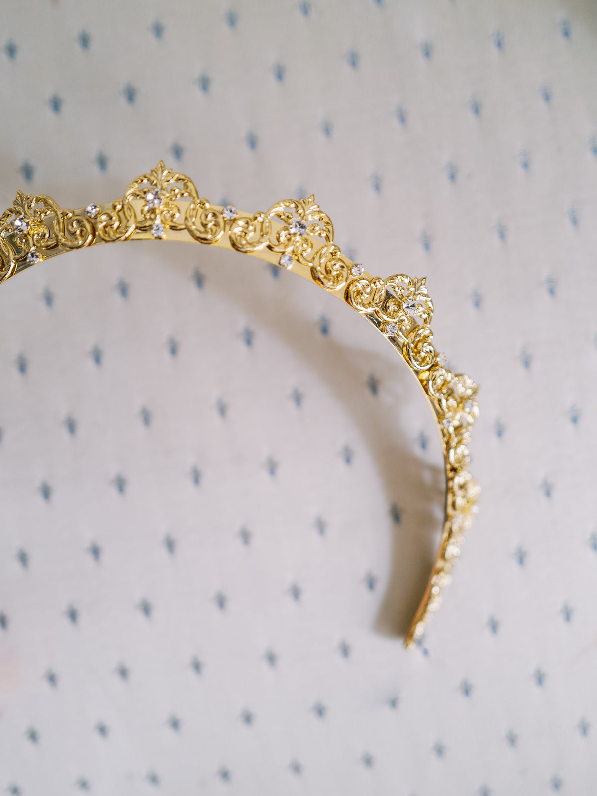 Close-up detail of the Antoinette Halo, a 14k gold plated French Rococo scrollwork headband hand-set with Swarovski crystals, Sophie Kaye x EDEN LUXE Revolution Collection | EDEN LUXE Bridal