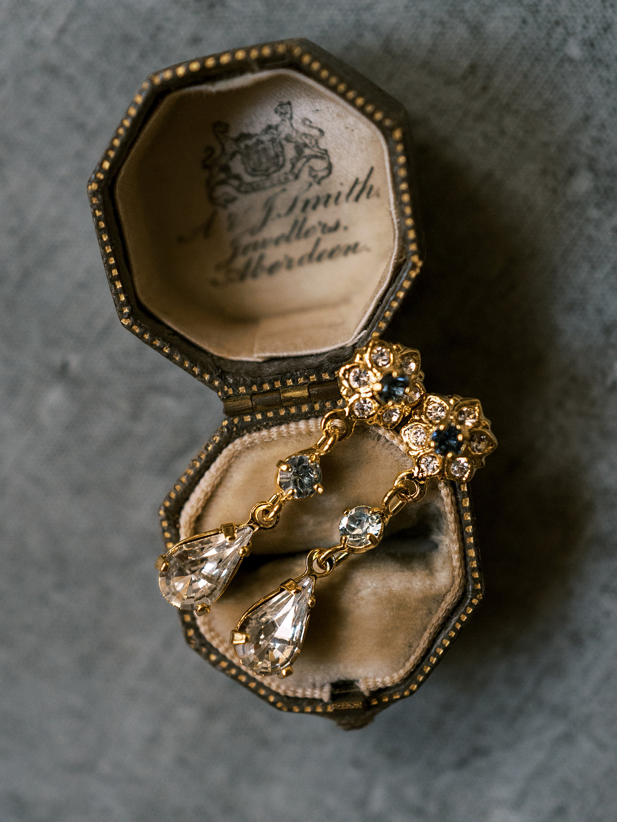 Madame Brillon Earrings, 14k gold plated French blue and clear Swarovski crystal teardrop earrings, displayed in an antique jeweler's box, Sophie Kaye x EDEN LUXE Revolution Collection | EDEN LUXE Bridal