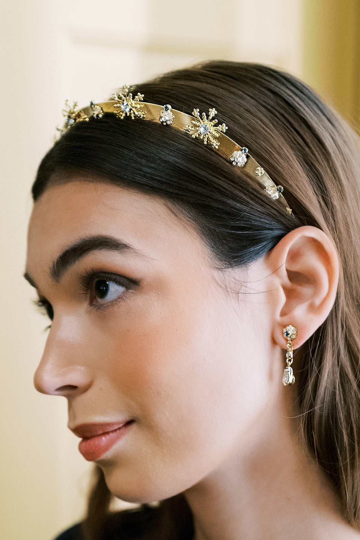 Model wearing the Madame Brillon crystal drop earrings with the matching Madame Brillon fireworks headband, luxury holiday and New Year's Eve jewelry | EDEN LUXE Bridal