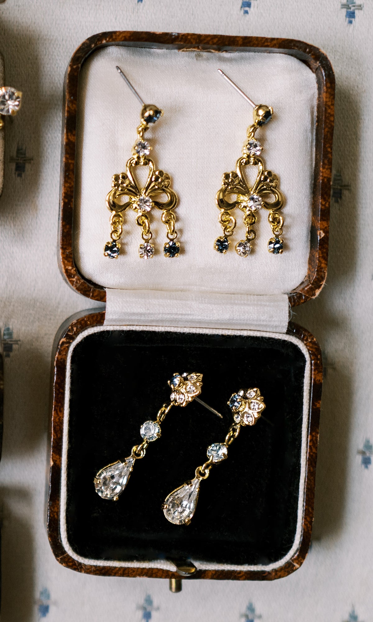 Martha Chandelier Earrings and Madame Brillon Earrings in antique jewelry boxes, 14k gold plated Swarovski crystal earrings from the Sophie Kaye x EDEN LUXE Revolution Collection | EDEN LUXE Bridal